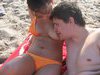 Nibbling nipples on the beach