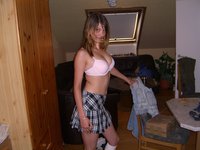 Cute teen posing in heels and mini skirt