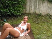 Blond amateur wife posing around house