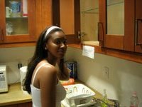 Beautiful ebony girl at kitchen