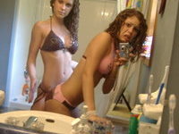 Sexy curly haired twin teen sisters