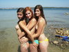 Teenage amateur couple at vacation with friends