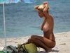 Busty blonde babe topless at beach