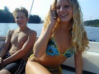 Slutty blonde fucked at yacht by two boys