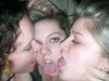 Three kinky girls kissing