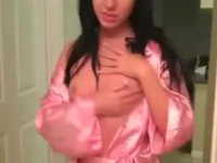 Brunette in pink bathrobe does blowjob and sex in the bathroom