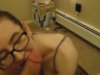 Babe with natural tits and glasses sucks dick