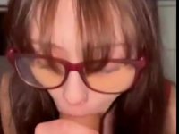 Nerdy GF with big glasses sucking his huge dick