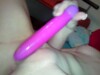 Babe with shaved pussy plays with sex toy