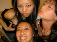 Three Girls Play Around With A Camera