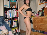Black Haired Teen Strips For The Camera