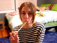 Kinky Teen Licking Lollipop