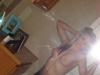 Nude Blonde In Front Of The Mirror