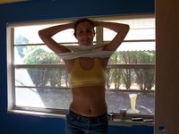Posing topless at home