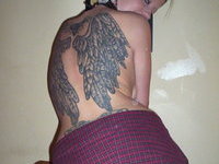 Tattooed chick posing