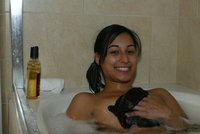 Tanned chick is wet
