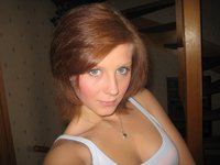 Redhead Poses And Gets Naked