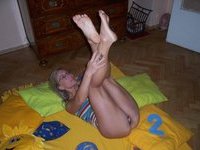 Spreading her legs