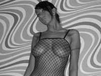 Busty babe in fishnets