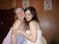 Sweet lesbians stripping and smiling