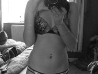 Teenage amateur girl posing topless in her room