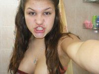 Busty amateur teen showing her tits