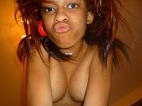Ebony slut posing nude at home