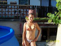 Cute amateur girl posing topless outdoors
