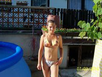 Cute amateur girl posing topless outdoors