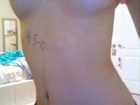 Sexy teen making topless selfshots