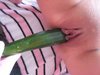 Cucumber in her pussy