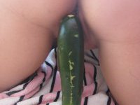 Cucumber in her pussy