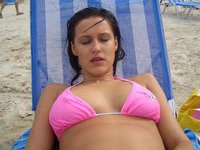 Amateur brunette topless at beach