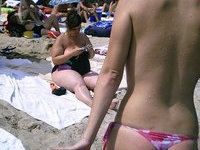 Yong amateur GF topless at beach