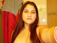 Young amateur latina posing topless