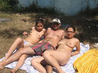 One lucky guy sunbathing with three hot girls