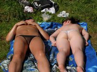 Two amateur girl sunbathing topless
