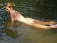 My wife sunbathing topless