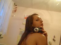 Cute young amateur wife making selfie
