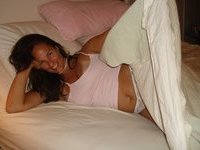 Julia posing on bed