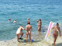 Nude group of girls on the beach
