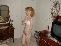 Redhead wife shows her body