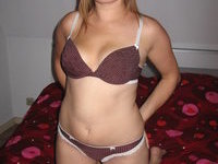 Brunette amateur wife posing on bed
