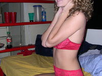 Curly amateur coed in her room