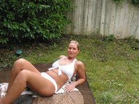 Big tits blonde posing in the garden