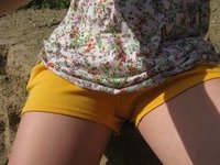 Horny girl posing topless oudoors