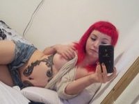 Tattoed redhead girl