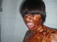 Brunette takes a chocolate bath