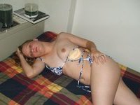 Blonde teen Alina posing nude on bed