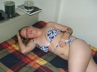 Blonde teen Alina posing nude on bed